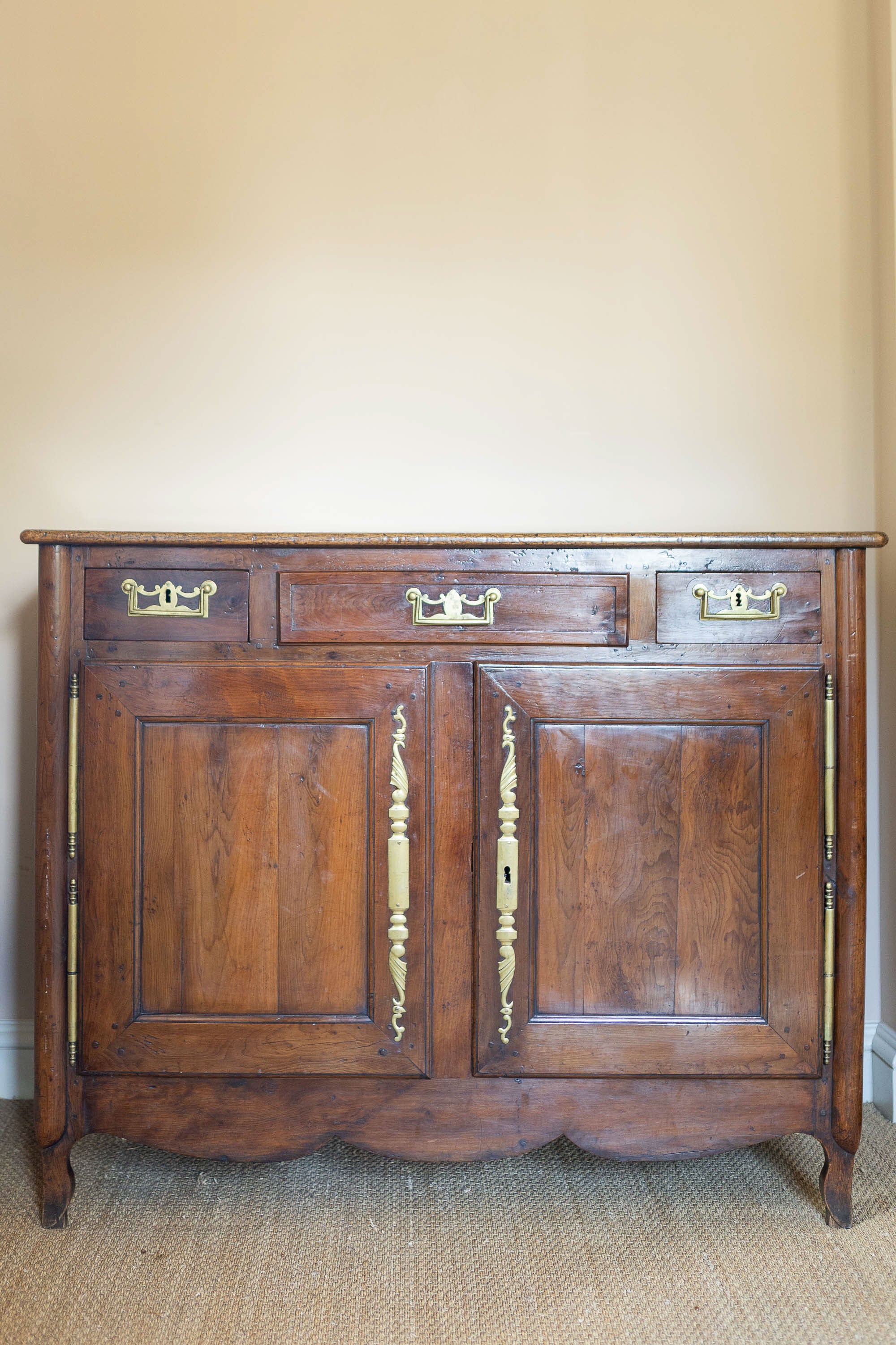 A Louis XV Yew and Elm Cupboard